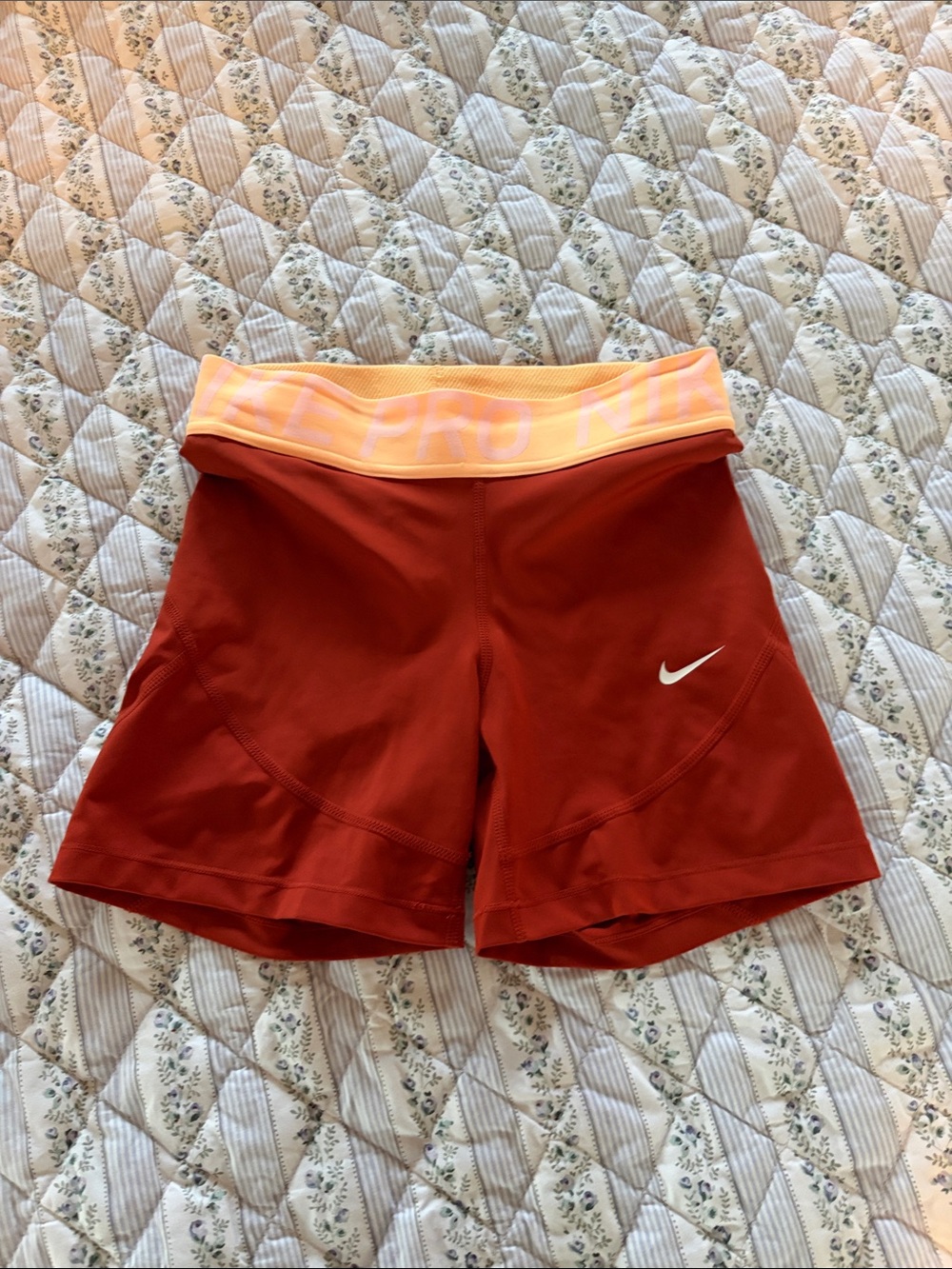 Nike Women’s dark orange Athletic Shorts with Peach Waistband